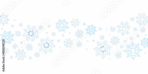 A light blue snowfall of various sized snowflakes on a white background