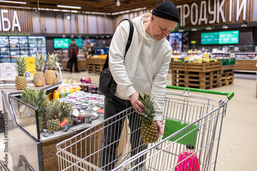 Man shopping in supermarket