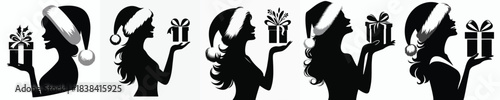 vector silhouette of a woman carrying a Christmas gift