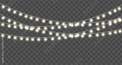 String of glowing warm fairy lights or christmas lights hanging in curved lines