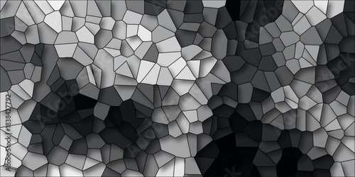 Dynamic grayscale mosaic texture with faceted polygonal shapes and dramatic light and shadow creating a textured abstract background for design