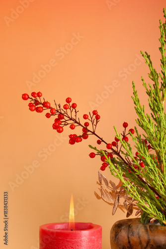 red candle and christmas decoration