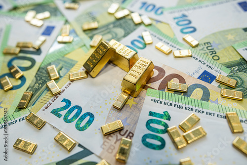 Golden bullion and euro currency notes, concept of stable economy, savings and capital growth