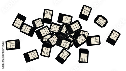 A scattered collection of black sim cards arranged on a white surface