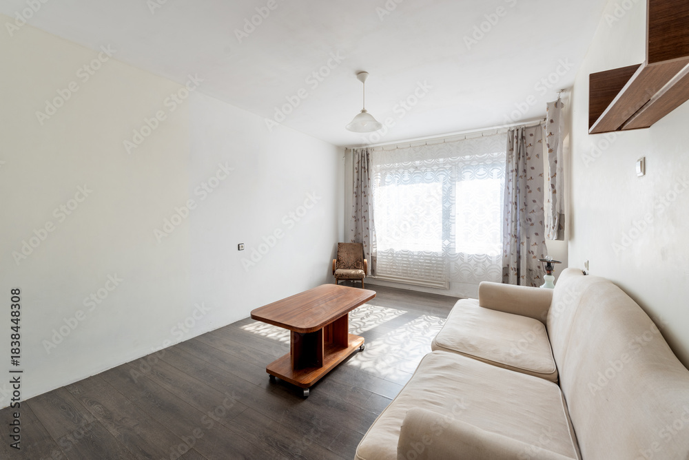 Fototapeta premium Modern Living Room with Natural Light, Wooden Furniture, and Cozy Decor