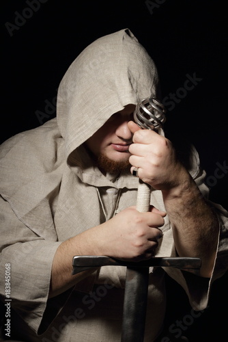 A menacing fat warrior monk with a sword