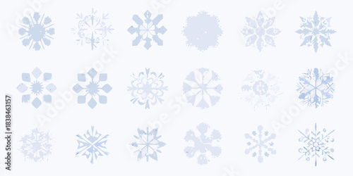 An assortment of delicate pale blue snowflakes on a white background