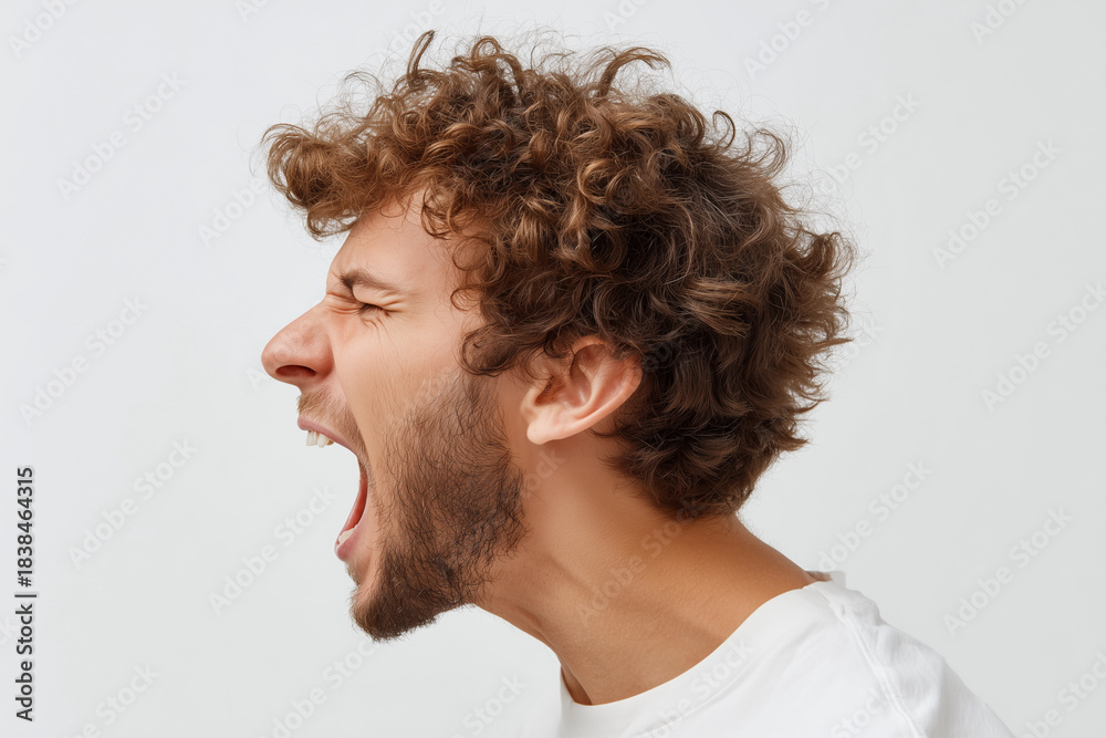 Fototapeta premium A man with a beard and curly hair is yelling