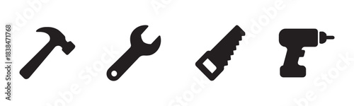 Four black silhouette icons of various construction tools, including a hammer, wrench, hand saw, and power drill, presented in a clean, minimalist, and iconic style