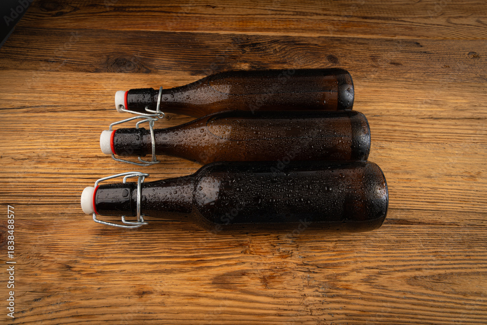 Obraz premium Old beer bottle, brown glass vintage beerbottle, a quality traditional time-tested drink symbol