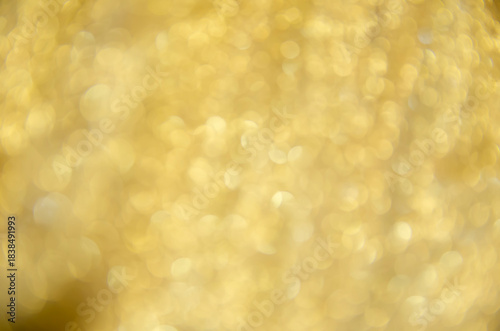 Yellow glow. Abstract background. Light and bokeh. A bright holiday template. Background for congratulations. A screen saver with a Bokeh.