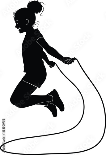 Silhouette of a young girl jumping rope in motion