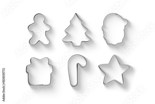 Set of Christmas gingerbread cookies metal cutters isolated on a transparent background, including star, gingerbread man and candy cane, PNG. High resolution.