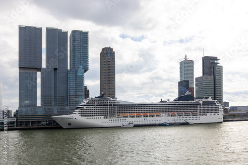 Large cruise ship is moored at the quay of the port city of Rotterdam