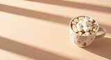 Flat lay composition featuring a tin cup with marshmallows and hot cocoa, set in warm sunlight with shadows (मार्शमैलो)