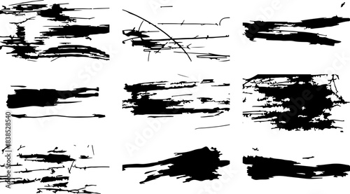 Collection of nine black abstract grunge brush stroke textures on white background