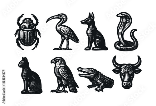 A collection of black and white ancient Egyptian animal icons features a scarab, ibis, jackal, cobra, cat, falcon, crocodile, and bull — stock vector.