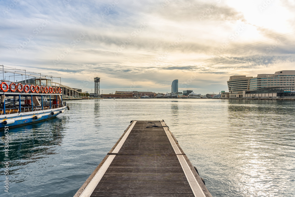 Fototapeta premium Tourist boat pier for a tour of the port of Barcelona, Spain.