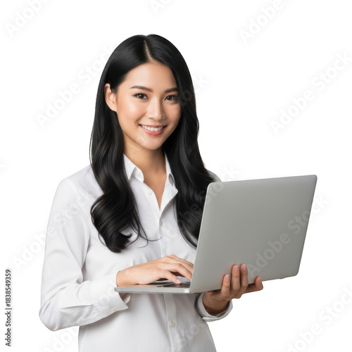 Smiling young asian woman wearing a white collared shirt holding and typing on a silver laptop isolated on transparent background