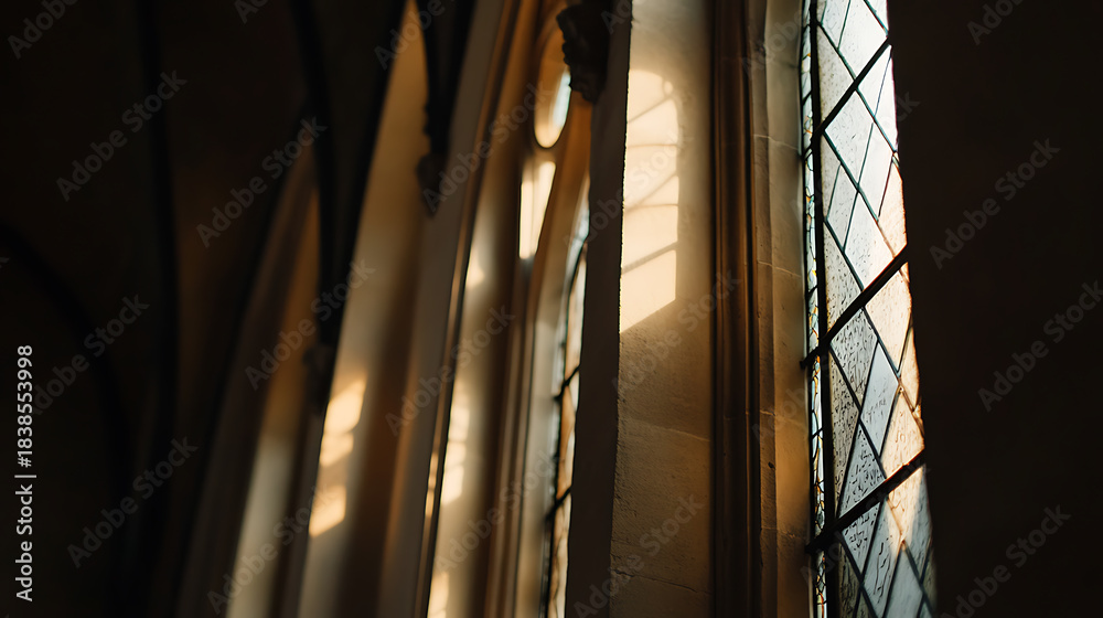 Obraz premium Golden light paints through the patterned window of the old room, creating an ethereal ambiance that blurs the line between past and present. A timeless sight.