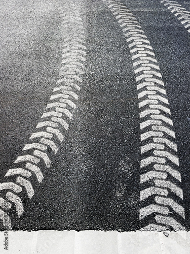 tire track imprint on the road, white painted 
