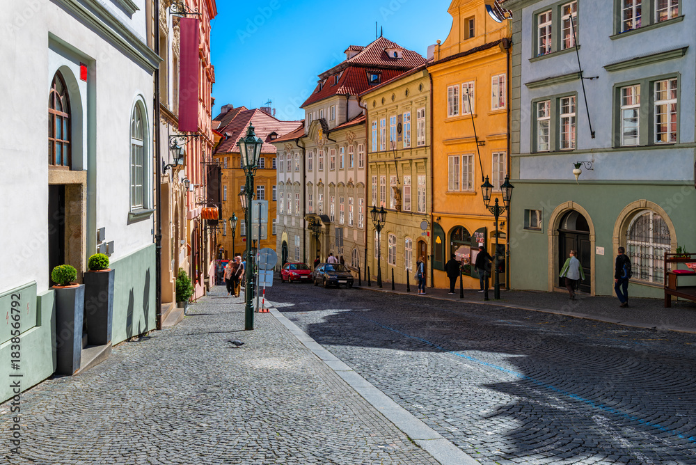 Obraz premium Old narrow streer in Lesser Town (Mala Strana) in Prague, Czech Republic. Cozy cityscape of Prague.