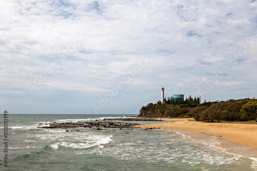 View along Point Cartwright Beach to the lighthouse at Buddina in Queensland Australia.