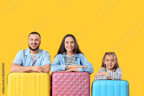 Family of travelers with su...