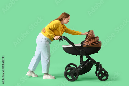 Young mother with baby stro...