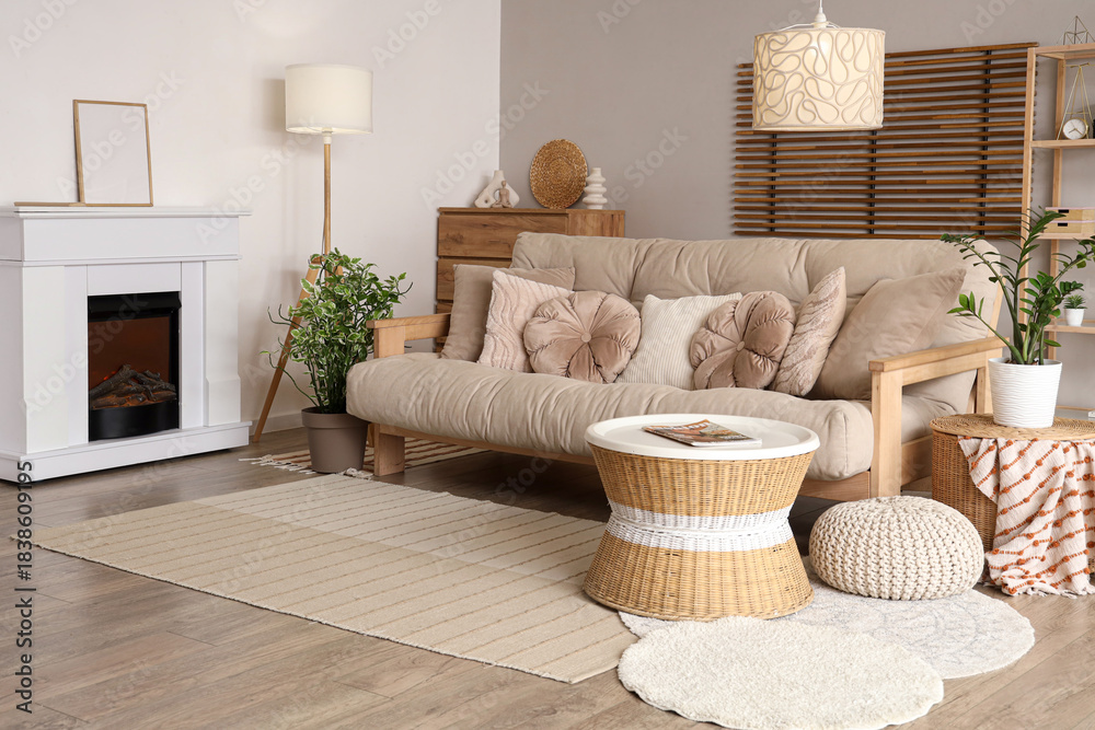 Fototapeta premium Cozy interior of living room with fireplace, sofa and table