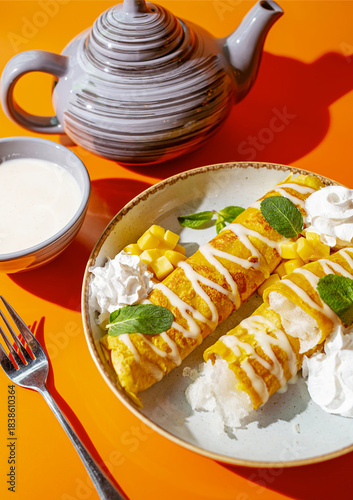 Crepes filled with whipped cream. Home cooking.