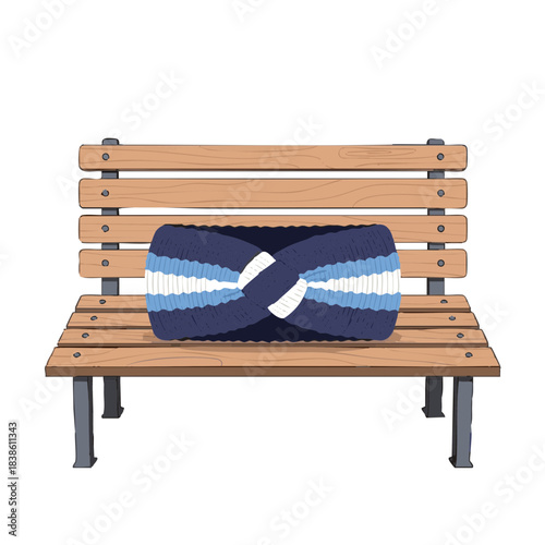 Knitted winter headband resting on a wooden bench in a park  