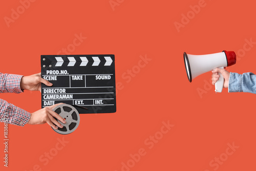 Hands with movie clapper, f...