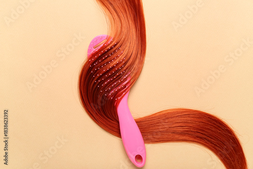 Ginger hair strand and brus...