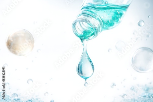 Drops of clear moisturizing liquid readily touch a clean white surface, demonstrating the natural ingredients and their benefits for skin.