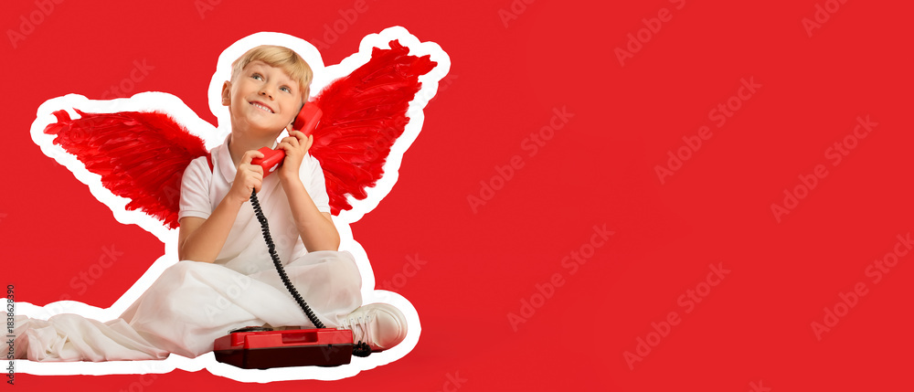 Naklejka premium Cute little happy boy dressed as cupid with retro phone sitting on red background. Valentine's Day celebration