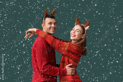 Young couple in reindeer ho...