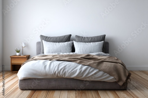 Cozy bedroom with a double bed, neutral bedding, and wooden floor.