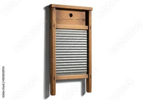 Antique wooden laundry washboard stands vertically against a plain white background