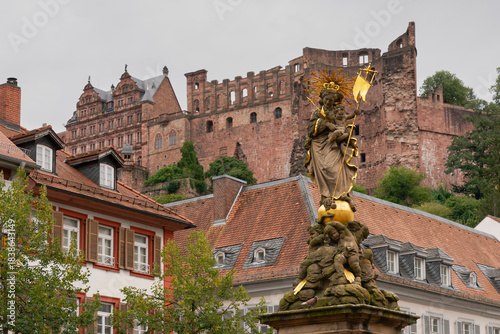 Kornmarkt Madonna Heidelberg Castle.The Madonna statue at the Kornmarkt square with the Heidelberg castle in the background.
