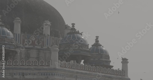 New Delhi, Delhi, India. Doves birds sitting on Isa Khan's Tomb near The Humayun's tomb. Famous place is Tomb of Mughal emperor, Mirza Nasir al-Din Muhammad commonly known as Humayun situated in Delhi