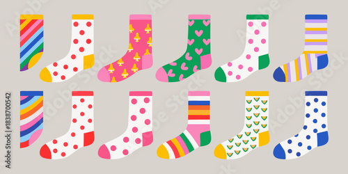 Colorful mismatched socks with various patterns arranged in a playful composition
