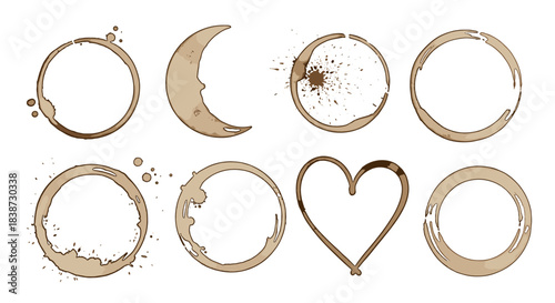 A collection of realistic brown coffee cup stains and splatters in various shapes including a heart and moon on a background.