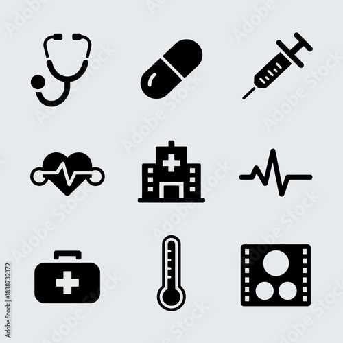 Set of medical icons including stethoscope, pill, syringe, hospital, heart, first aid kit, thermometer, and xray