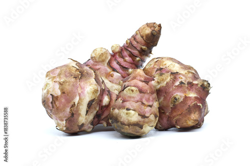 Fresh Jerusalem artichokes isolated on a white background, ready for cooking