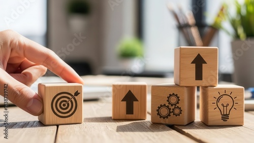 Wooden cubes showing productivity alignment icons positioned manually using realistic depth and gentle blurred background