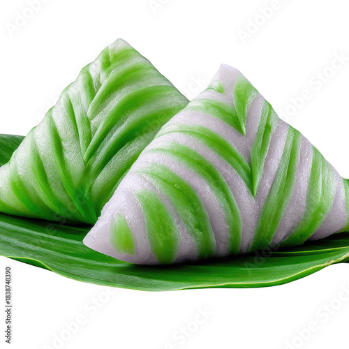 Delicately Crafted Green and Purple Rice Dessert on a Leaf Plate for Traditional Asian Cuisine Presentation