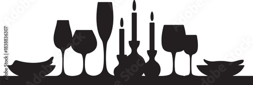 Black silhouette of wine glasses and candles on a table