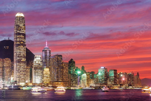 Canvas Print Hong Kong city skyline at sunset with glowing sky and skyscrapers