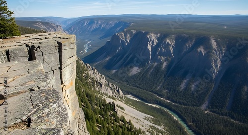 Dramatic canyon vista with steep cliffs and winding river below